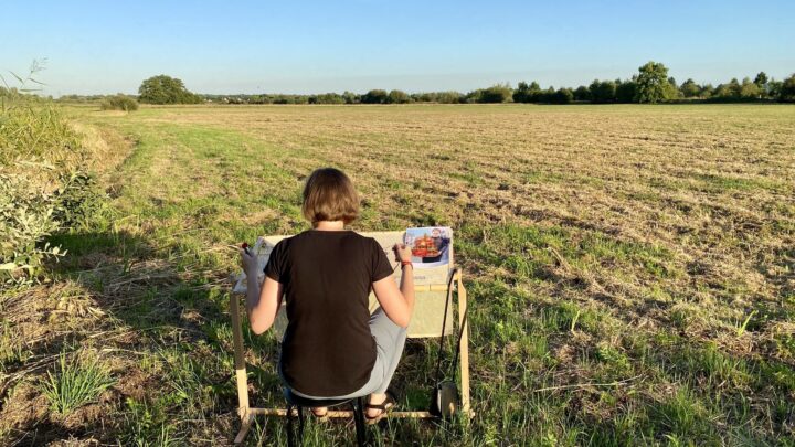 Małgorzaty Samborskiej creating her embroidery work in the fields