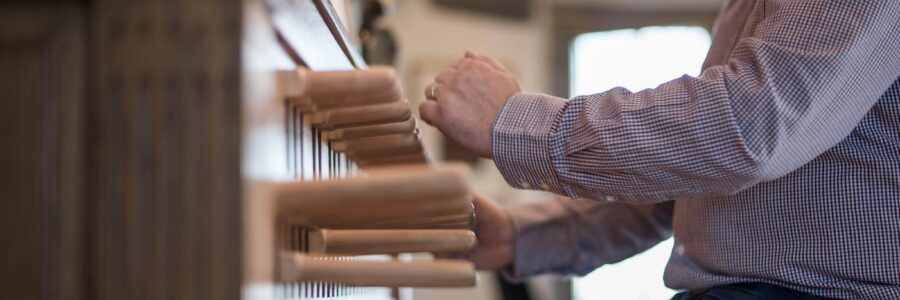 A man playing the keyboard of a carillon.